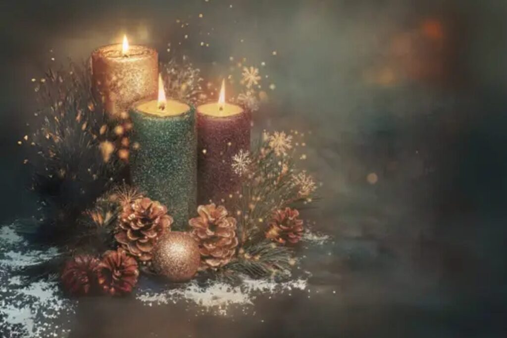 Advent candles glowing softly with evergreen branches and pinecones, symbolizing light meant to be shared through kindness, hope, and presence.